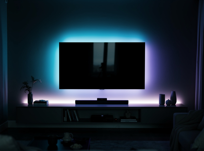 LED light strip glowing behind TV creating ambient bias lighting
