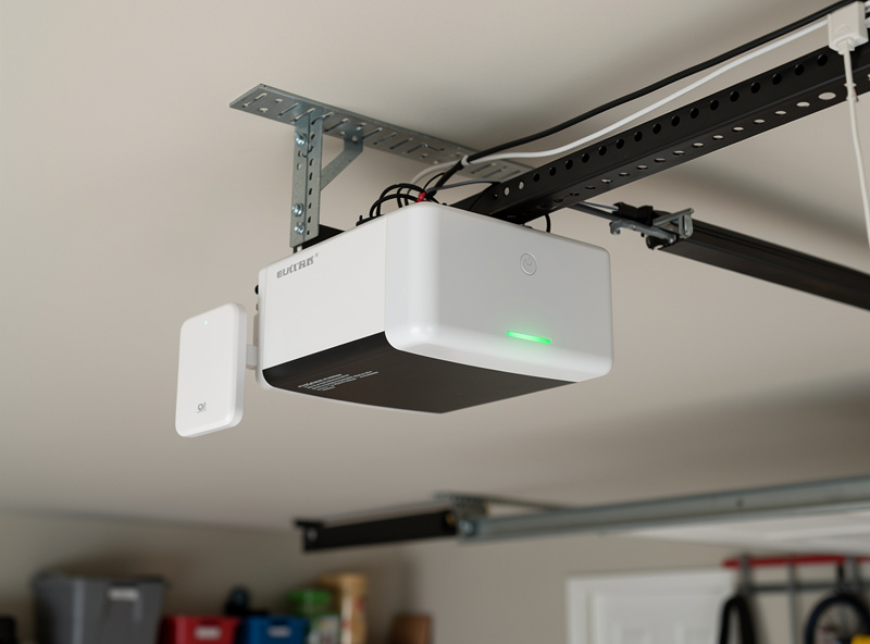 WiFi smart garage door controller mounted next to garage opener motor