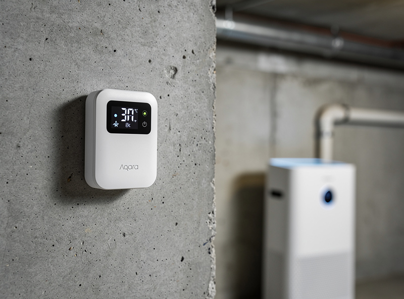 Smart humidity sensor mounted on a basement wall monitoring relative humidity