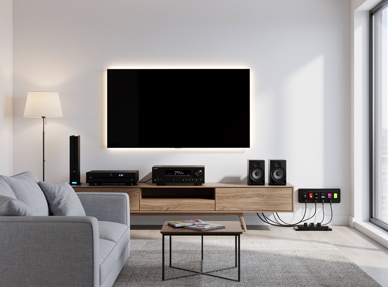Entertainment center setup with smart power strip managing TV, gaming console, and sound system
