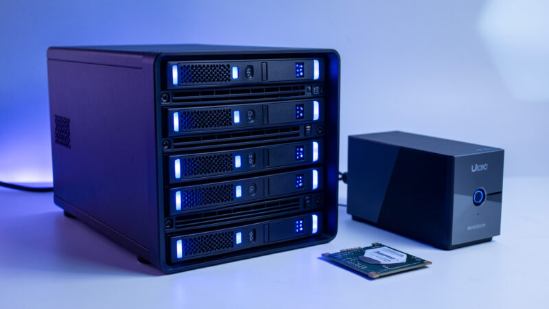 Home NAS unit with several hard drives and an SSD beside a mini-PC